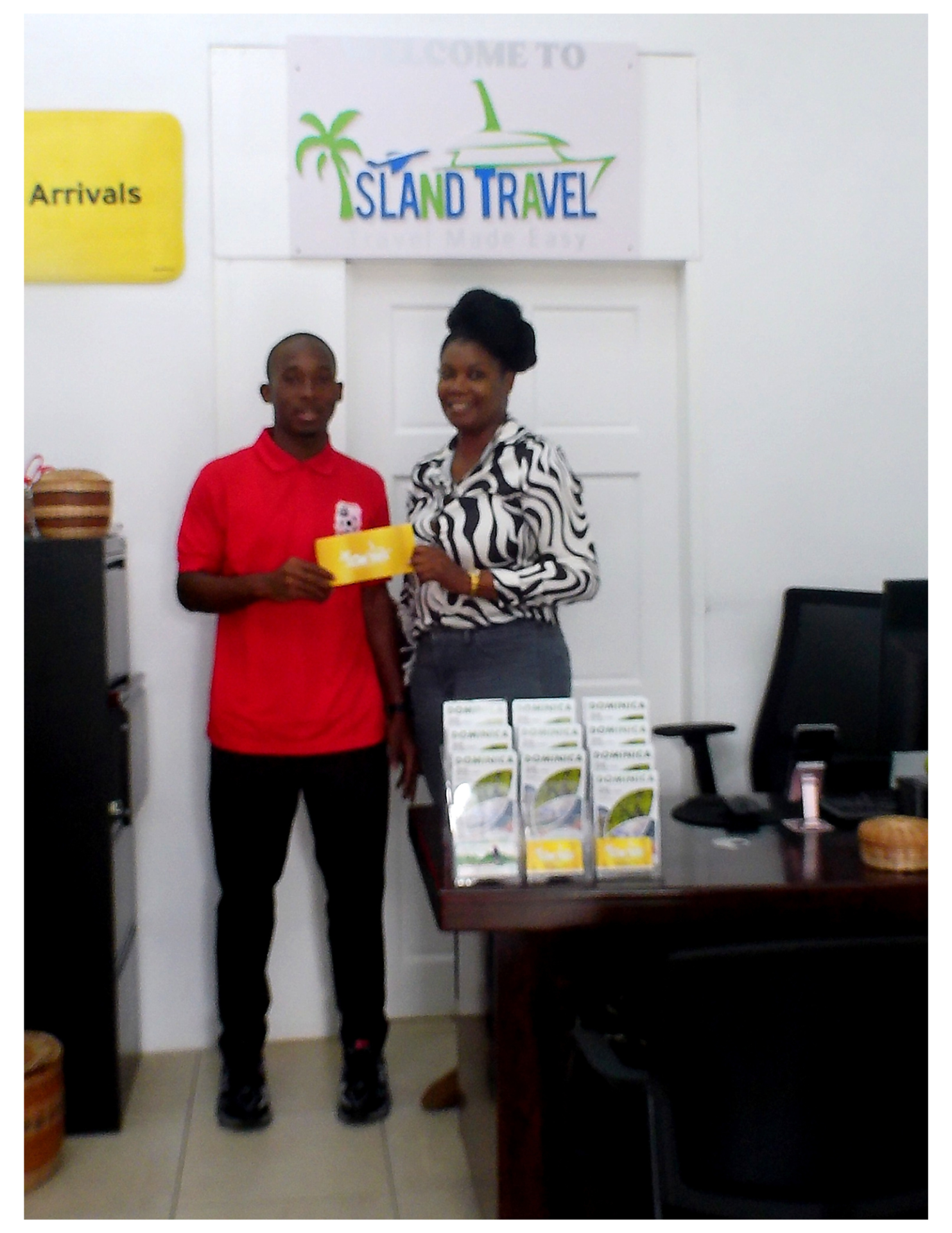 Nichole Andrew of Island Travel, Portsmouth (Indian River), presents a travel ticket to Possie Cup standout Davonne George, supporting his journey to the European Development Tour opportunity.