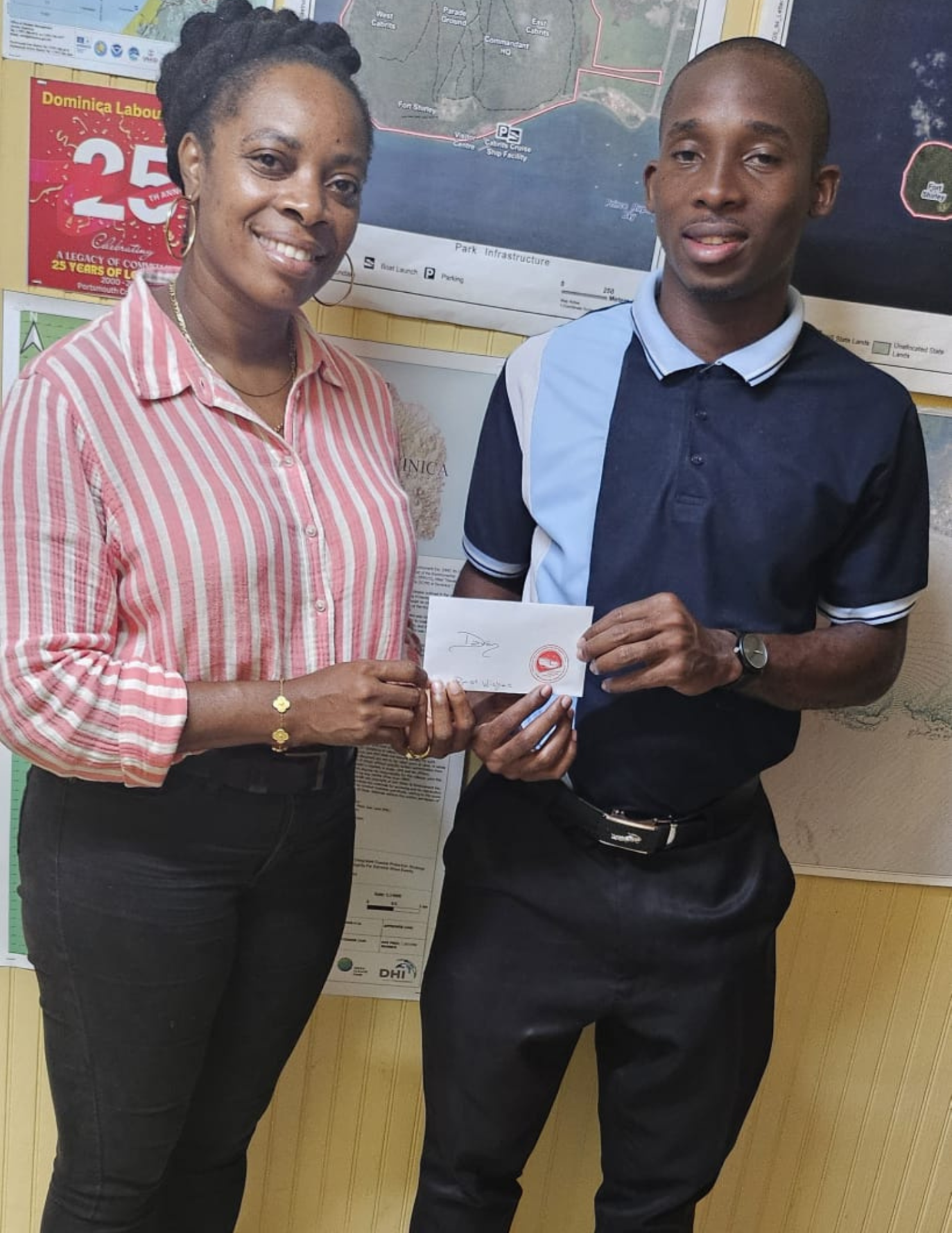 Hon. Fenella Wenham Sheppard presents a financial contribution to Possie Cup standout Davonne George, supporting his journey to the European Development Tour opportunity.